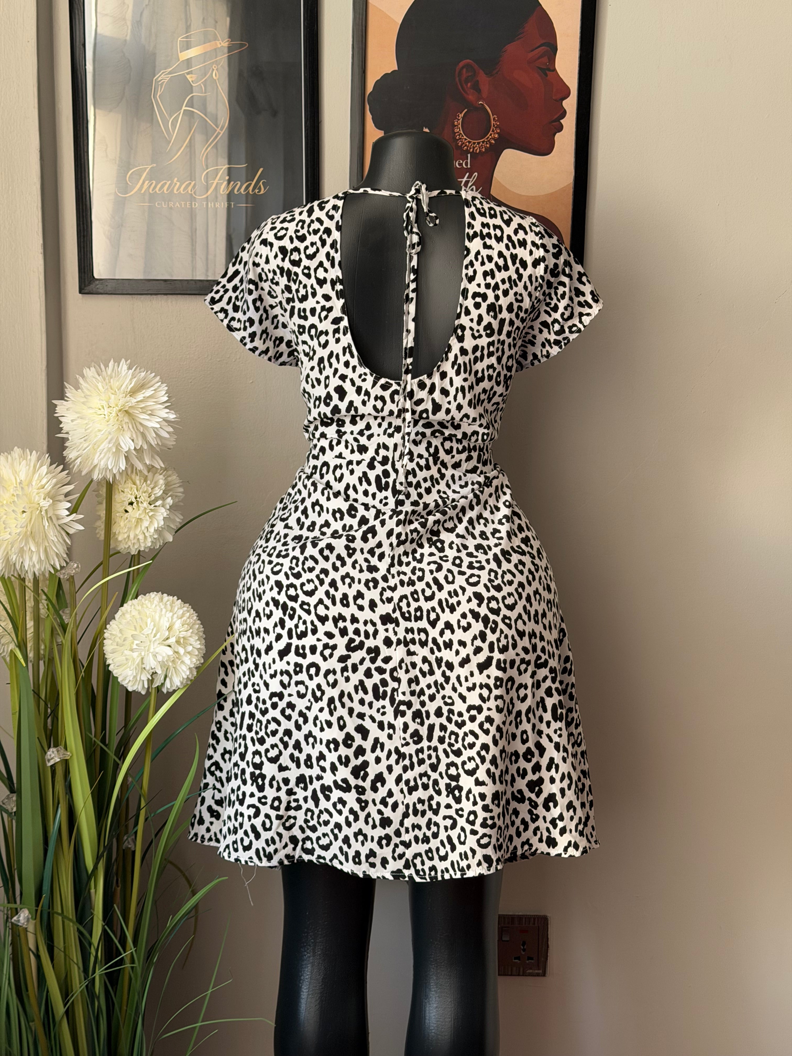 White skater featuring a bold leopard print